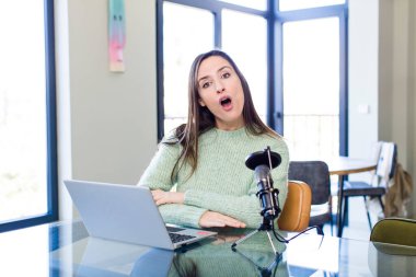 young pretty woman looking very shocked or surprised. influencer concept