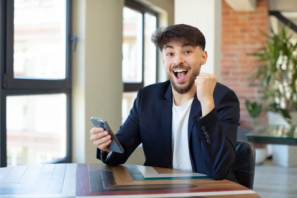 Young Handsome Man Feeling Shocked Laughing Celebrating Success Smartphone Concept — Stock Photo, Image
