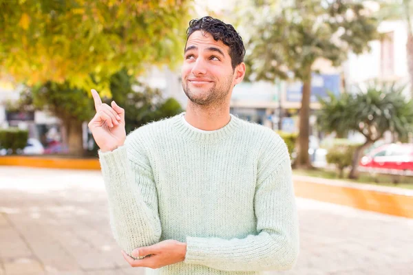 Young Hispanic Man Smiling Happily Looking Sideways Wondering Thinking Having — Stock Photo, Image