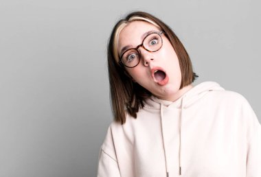 young pretty woman expressing a concept with a copy space