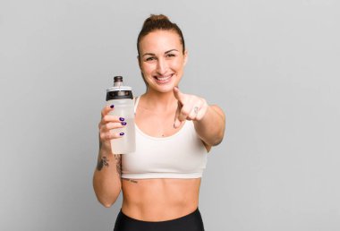 young pretty woman with water bottle. fitness concept