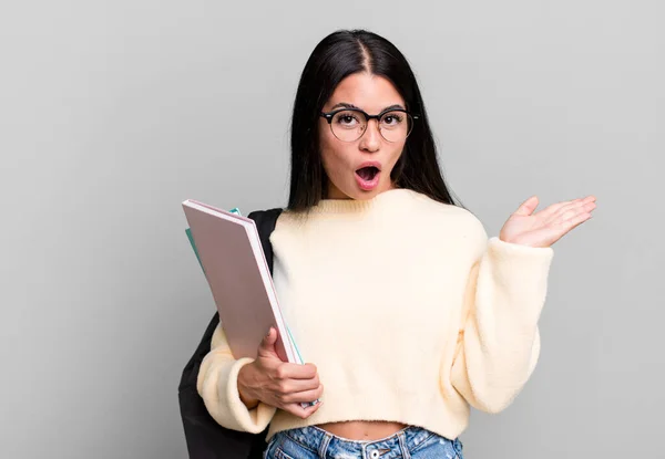 Hispanic Pretty Woman Looking Surprised Shocked Jaw Dropped Holding Object — 스톡 사진
