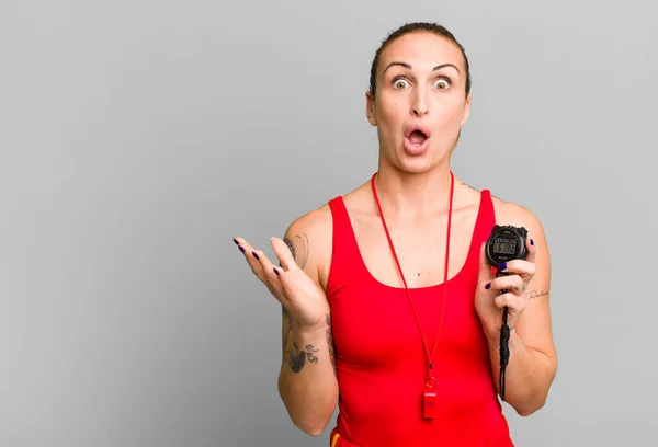 Young Pretty Woman Feeling Extremely Shocked Surprised Swimm Coach Stopwatch — Stock Photo, Image