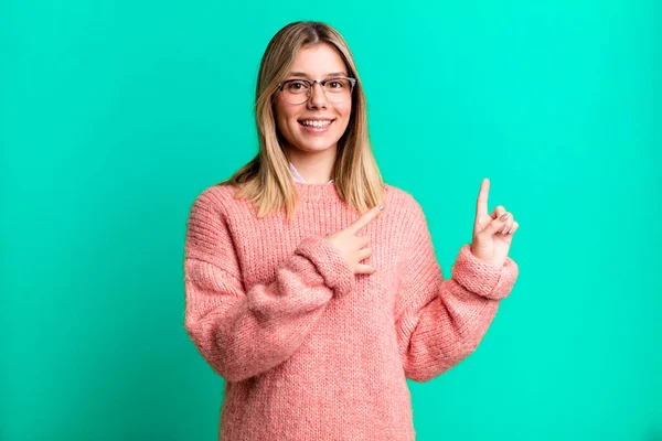 Blonde Pretty Woman Smiling Happily Pointing Side Upwards Both Hands — Stock Photo, Image