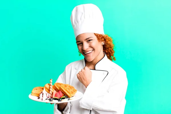 red hair pretty chef woman cooking waffles