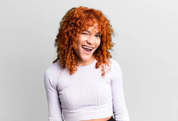 stock image redhair pretty woman with a big, friendly, carefree smile, looking positive, relaxed and happy, chilling