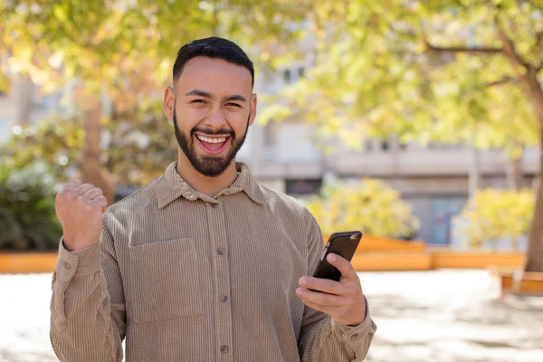 Young Adult Man Feeling Shocked Laughing Celebrating Success Using Smartphone — Stock Photo, Image
