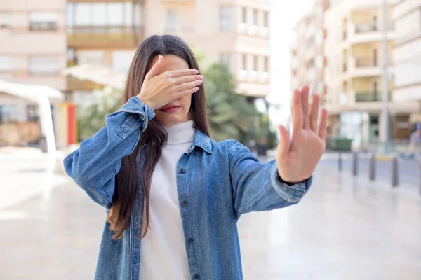 Pretty Young Adult Woman Covering Face Hand Putting Other Hand — Stock Photo, Image