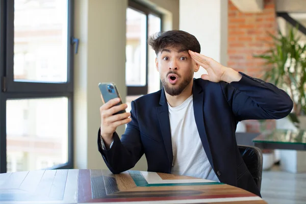 Young Handsome Man Looking Happy Astonished Surprised Smartphone Concept — Stock Photo, Image