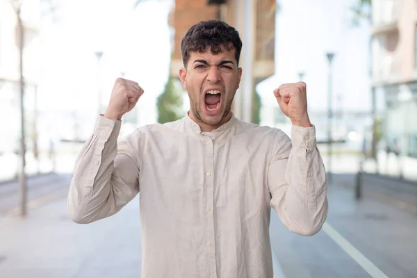 Young Handsome Man Shouting Aggressively Angry Expression Fists Clenched Celebrating — Stock Photo, Image