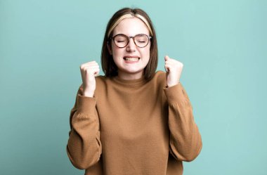 young pretty expressive woman with a copy space