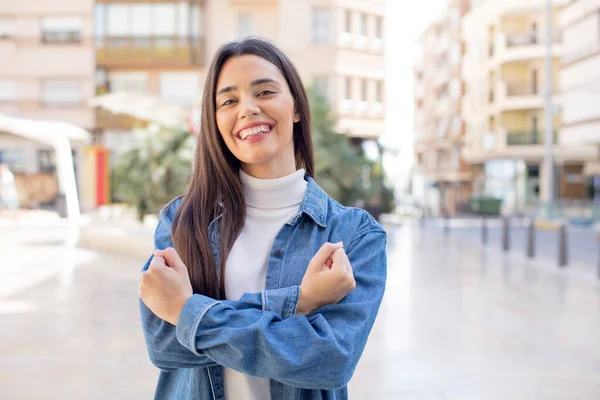 Pretty Young Adult Woman Smiling Cheerfully Celebrating Fists Clenched Arms — Stockfoto