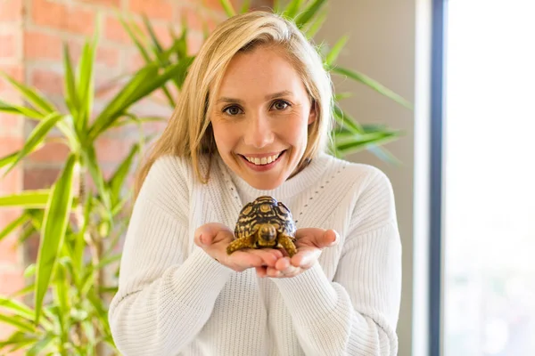 Young Adult Pretty Blonde Woman Holding Tortoise Pet Concept — Stok fotoğraf