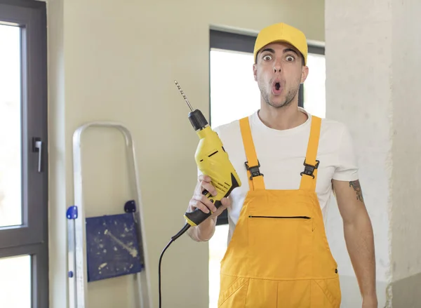 Young Handsome Man Feeling Extremely Shocked Surprised Handyman Concept — Stock Photo, Image