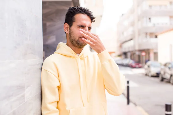 Young Hispanic Man Feeling Disgusted Holding Nose Avoid Smelling Foul — Stock Photo, Image