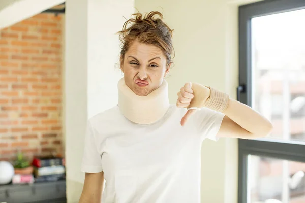 Young Pretty Woman Feeling Cross Showing Thumbs Accident Collar Concept — Stock Photo, Image