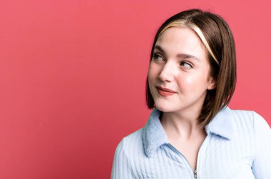 young pretty woman expressing a concept with a copy space