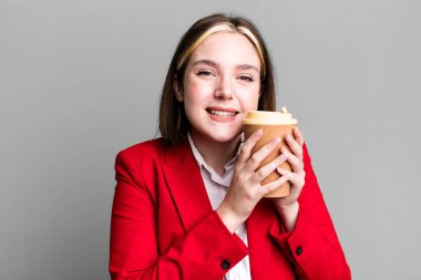young pretty businesswoman with a take away coffee