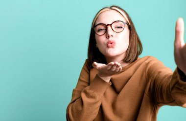 young pretty expressive woman with a copy space