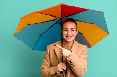 young pretty woman holding an umbrella