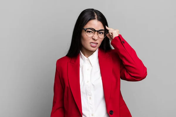 Hispanic Pretty Woman Feeling Confused Puzzled Showing You Insane Business — Stock Photo, Image