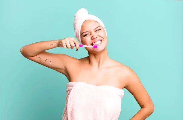 Hispanic Pretty Young Woman Wearing Bathrobe Ang Teeth Brush — стоковое фото