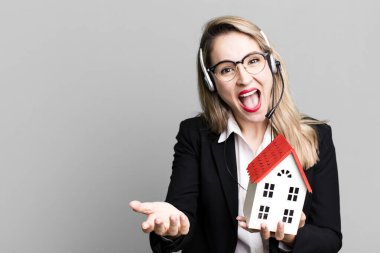 pretty caucasian woman with headset and real state concept