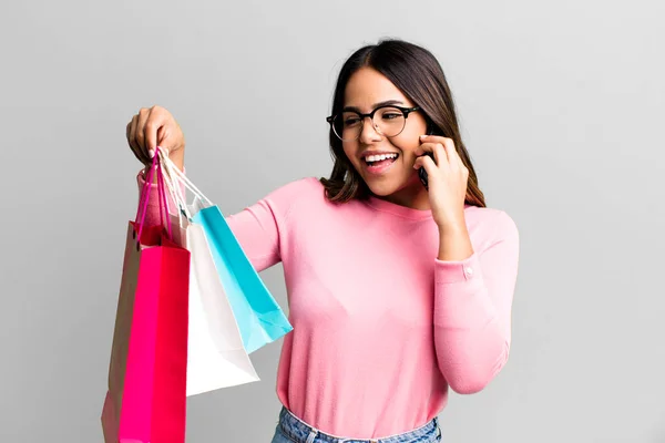 Hispanic Pretty Young Adult Woman Shopping Bags Her Smartphone Buy — Stok fotoğraf