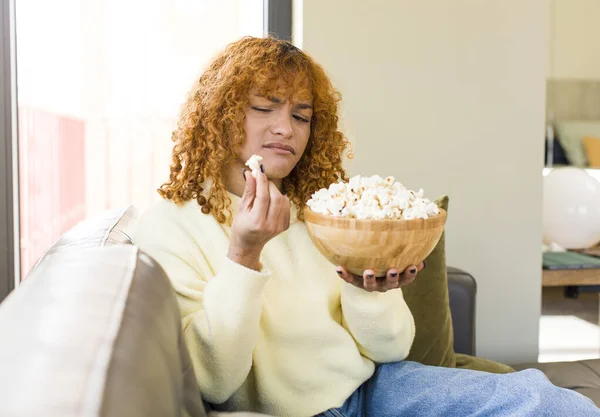 Young Red Hair Latin Pretty Woman Eating Popcorns Couch Watching — Fotografia de Stock