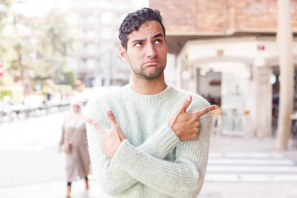 Young Hispanic Man Looking Puzzled Confused Insecure Pointing Directions Doubts — Stock Photo, Image