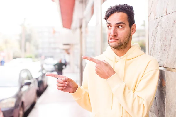 Young Hispanic Man Feeling Shocked Surprised Pointing Copy Space Side — ストック写真