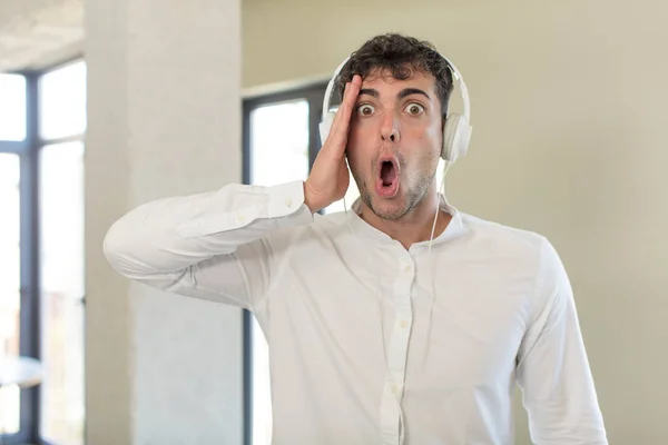 Young Handsome Man Feeling Extremely Shocked Surprised Listening Music Headphones — Stock Photo, Image