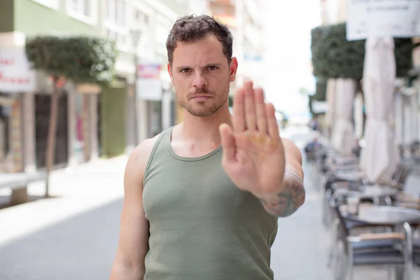 Handsome Man Looking Serious Stern Displeased Angry Showing Open Palm — Stock Photo, Image