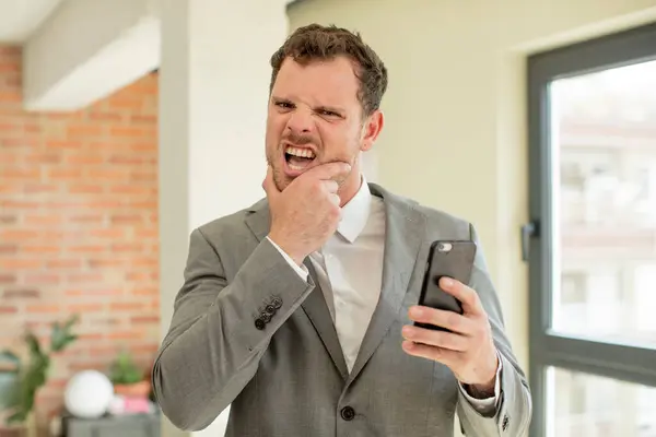 Mouth Eyes Wide Open Hand Chin Smartphone Concept — Stock Photo, Image
