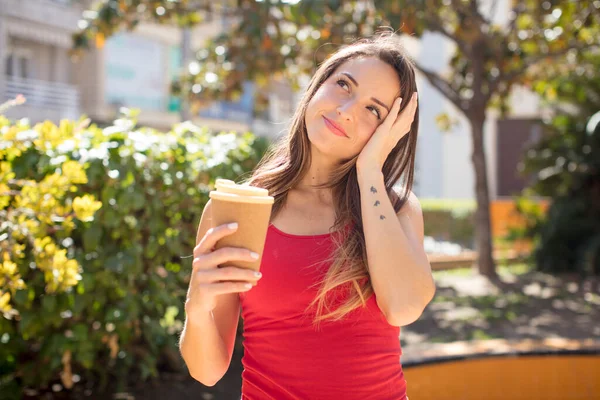 stock image pretty woman feeling bored, frustrated and sleepy after a tiresome. take away coffee concept