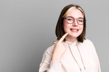 young pretty woman expressing a concept with a copy space