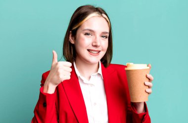 young pretty businesswoman with a take away coffee