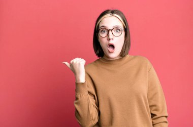 young pretty expressive woman with a copy space