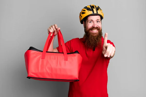 stock image long beard man smiling proudly and confidently making number one. pizza delivery concept