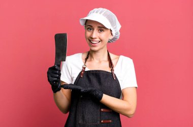 Neşeli bir şekilde gülümsemek, mutlu olmak ve bir konsept göstermek. Kasap konsepti