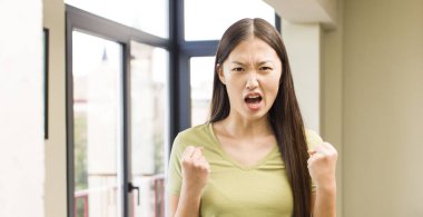 asian pretty woman at home with big windows background