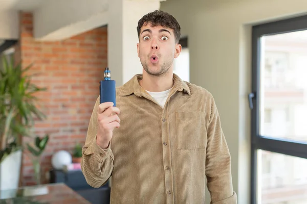 Young Handsome Man Feeling Extremely Shocked Surprised Vaper Smoking Concept — Stock Photo, Image