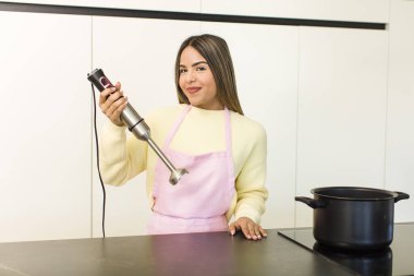 pretty latin chef woman cooking at home