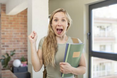 feeling shocked,laughing and celebrating success. university student concept