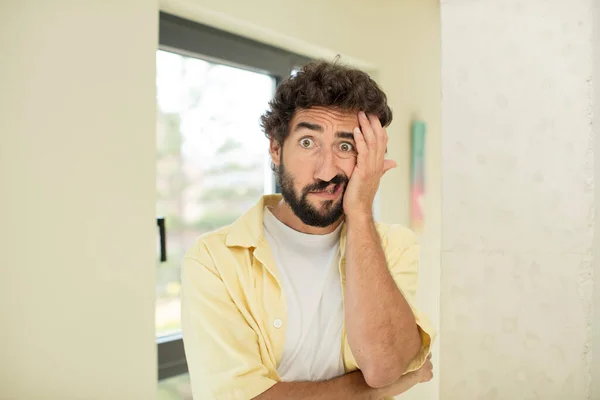 Young Crazy Bearded Man Open Mouthed Shock Disbelief Hand Cheek — Stock Photo, Image