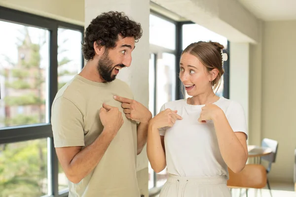 Young Adult Couple Looking Happy Proud Surprised Cheerfully Pointing Self — Stock Photo, Image