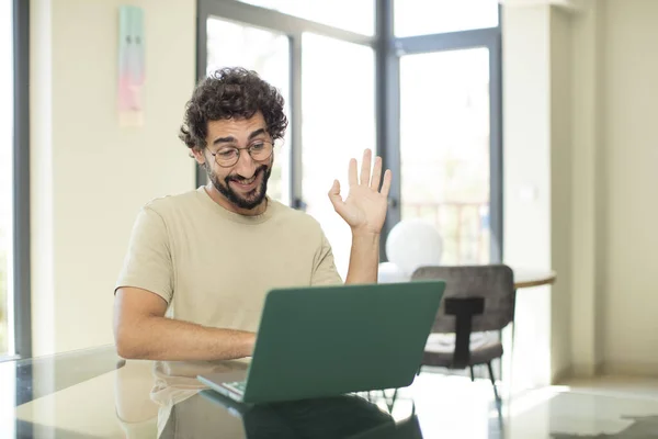 Young Adult Bearded Man Laptop Smiling Happily Cheerfully Waving Hand — Stock Photo, Image