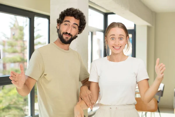 Young Adult Couple Holding Object Both Hands Copy Space Showing — Stock Photo, Image