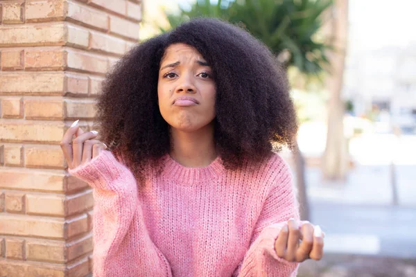 stock image african american pretty woman feeling sad and stressed, no money gesture, with a negative and anxious look