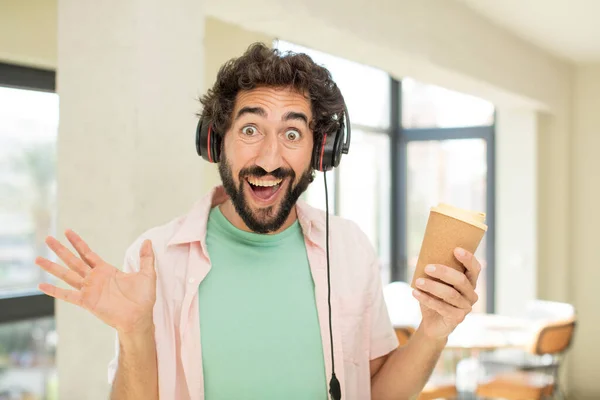 crazy bearded man feeling happy and astonished at something unbelievable. take away concept